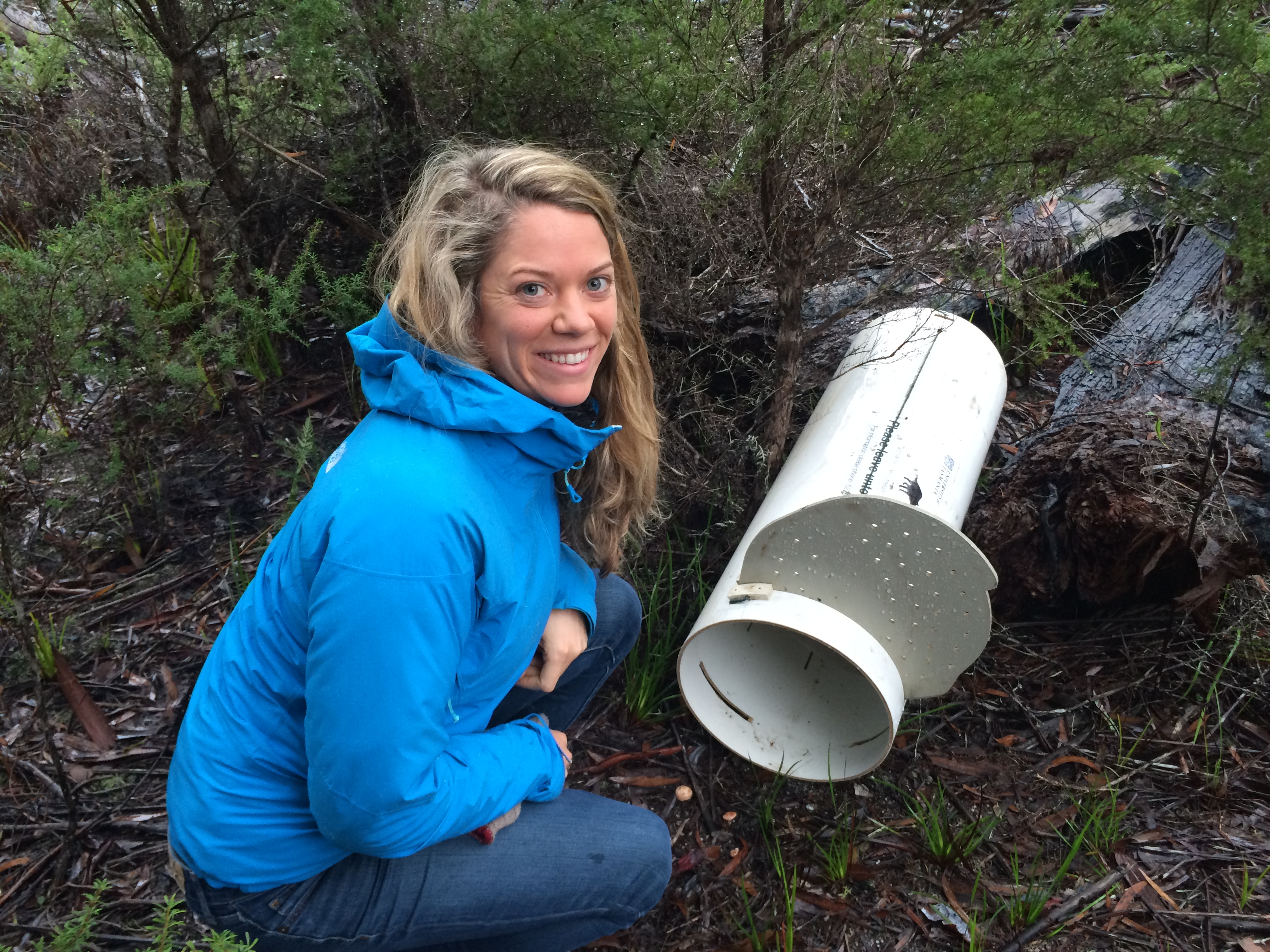 Sarah-kneeling-near-a-tasmanian-devil-trap