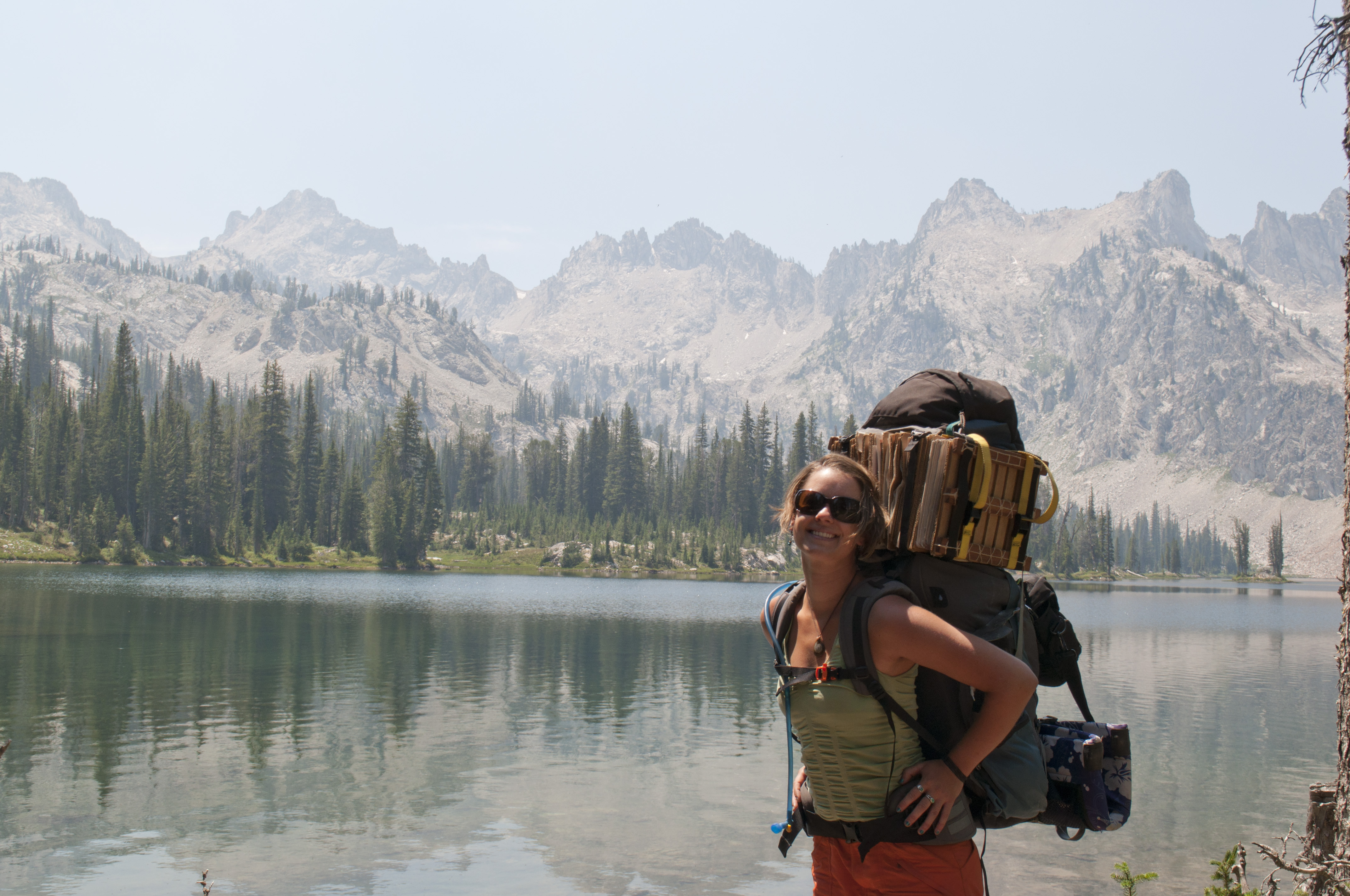 Hannah-next-to-mountain-lake-with-backpack